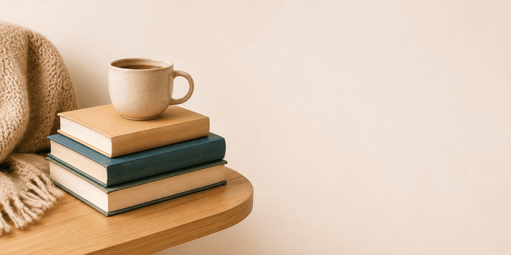Stacked books in a warm editorial banner composition